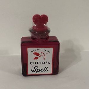 Glass bottle with heart silicon lid.Size 4”H X 3”W. pink red